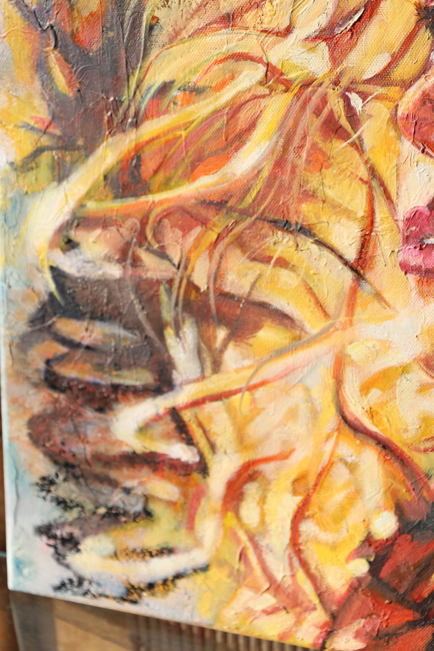 Abstract painting with warm colors on a textured surface